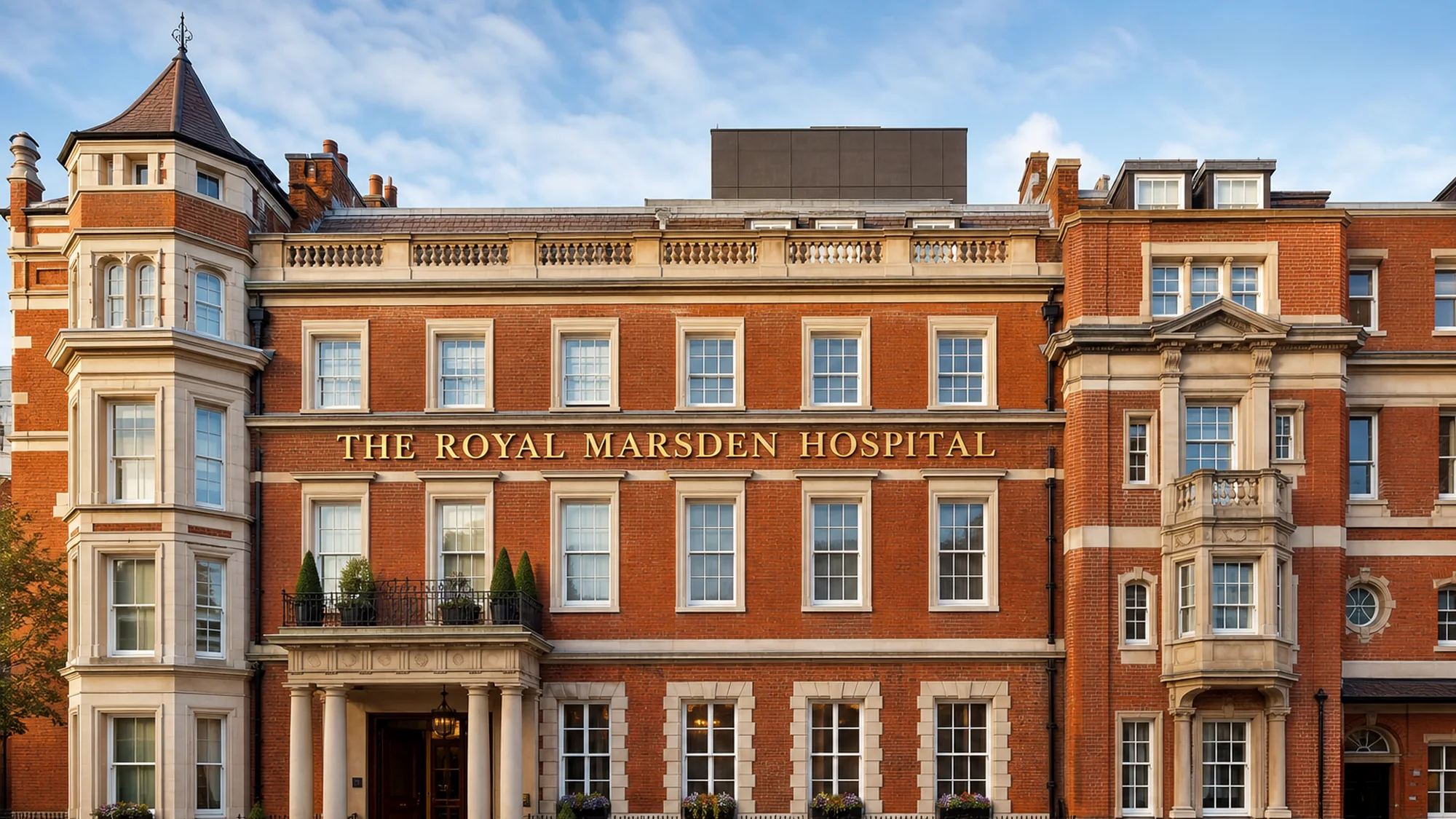 Illustrative generated image of a Victorian red-brick hospital facade with gold lettering reading The Royal Marsden Hospital, representing the Chelsea campus context. Not a documentary photograph of the building.